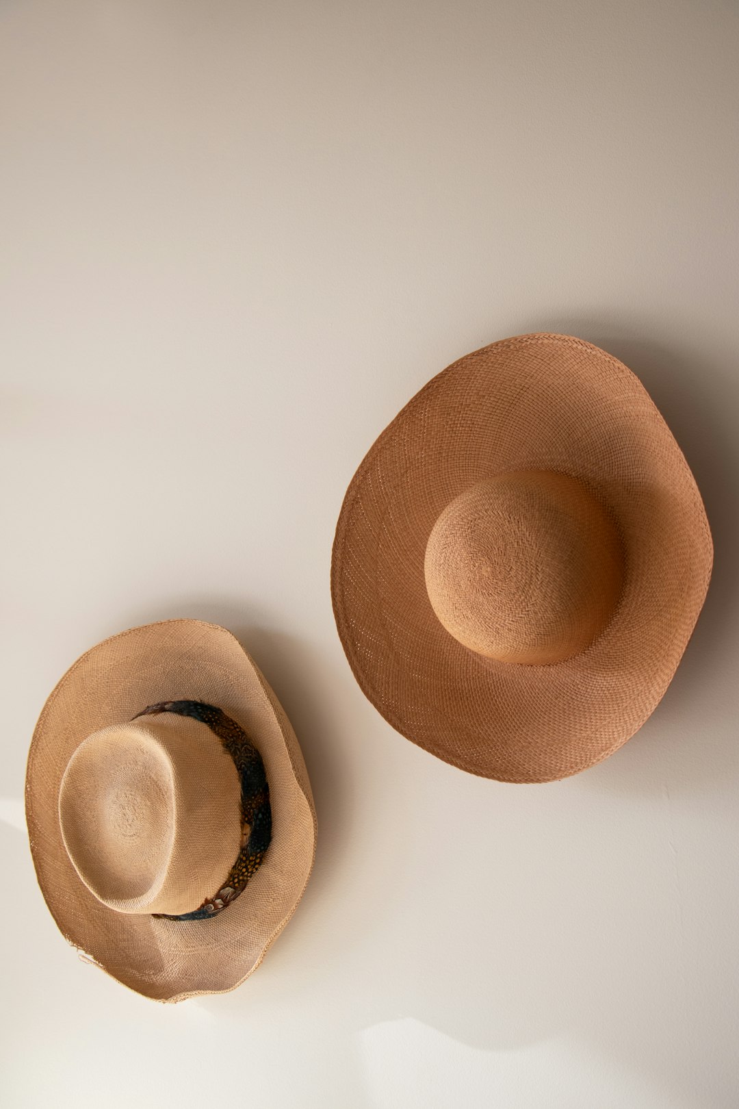 brown-hat-on-white-surface-accpkysn8xc